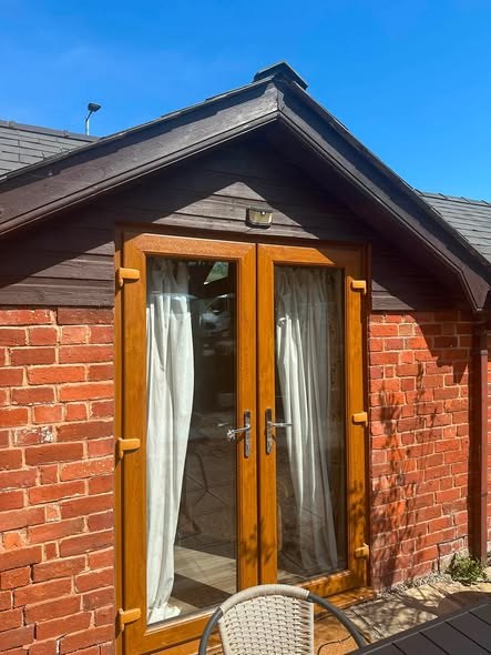 French doors on a brick outbuilding cleaned by CleanScape