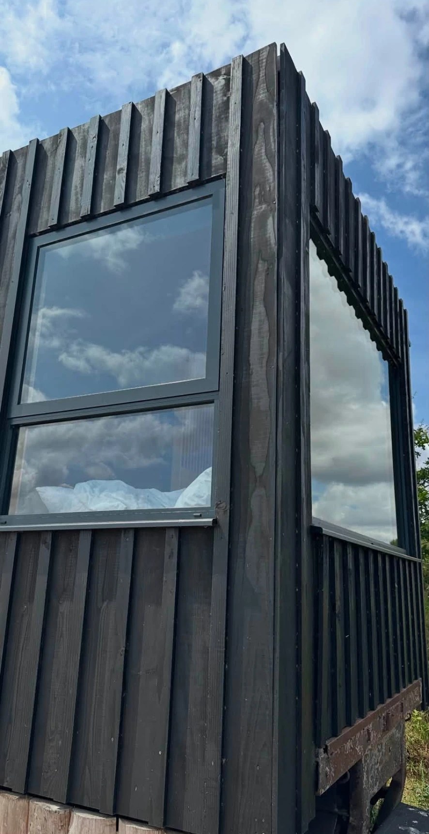 Dark-clad garden room with large windows cleaned by CleanScape